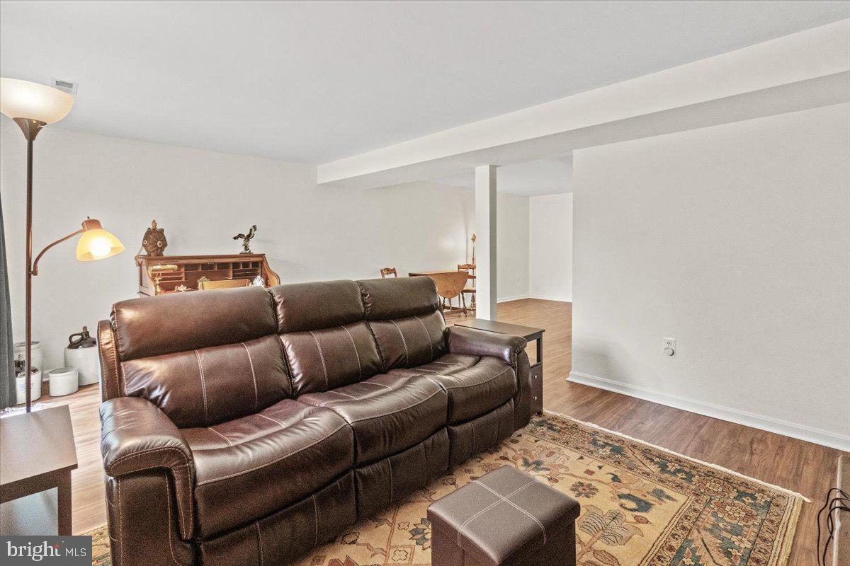 2218 West Greenleaf Drive Frederick, MD 21702 - Photo 23 of 46 a living room with furniture and a rug