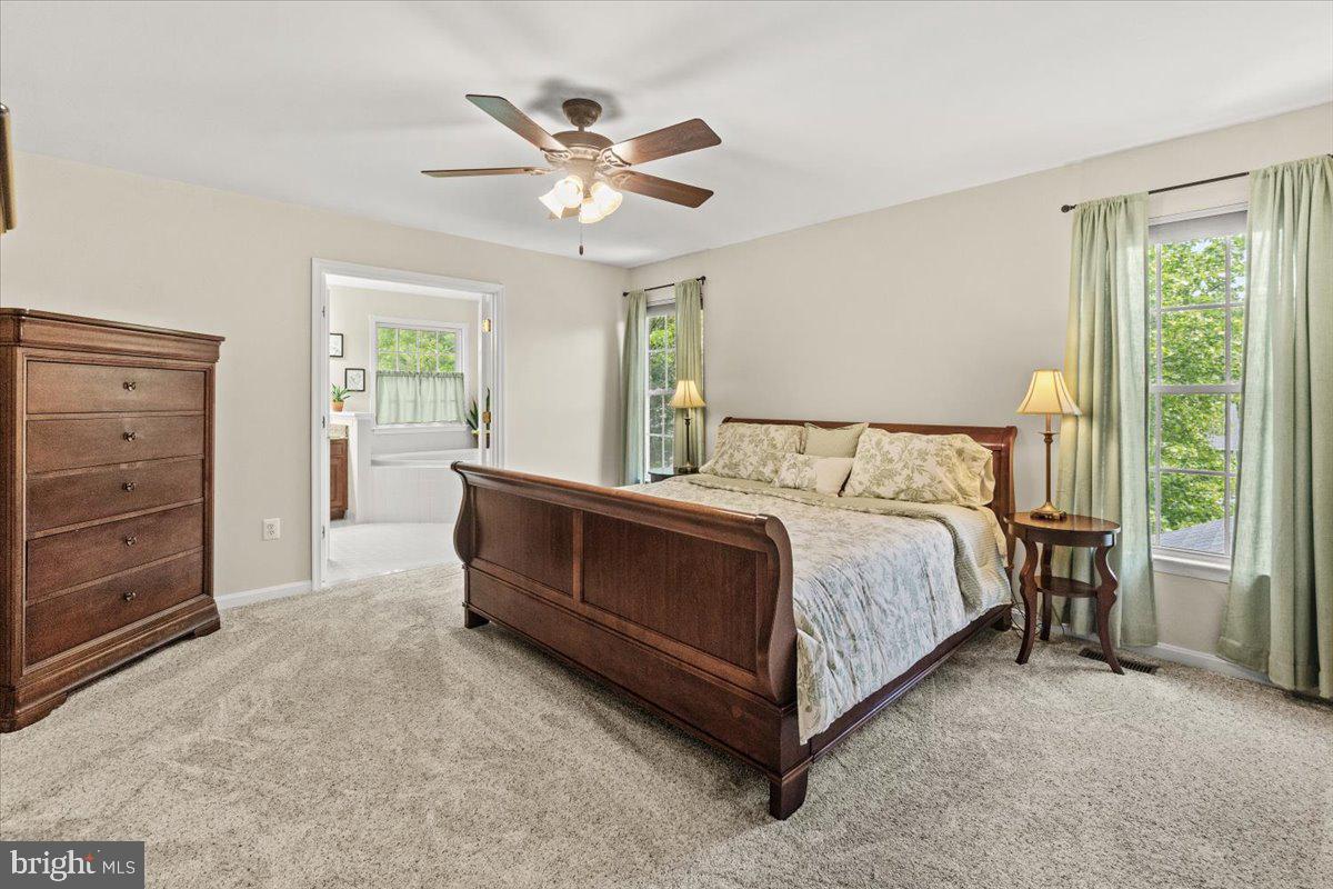 2218 West Greenleaf Drive Frederick, MD 21702 - Photo 29 of 46 a bedroom with a bed and a dresser