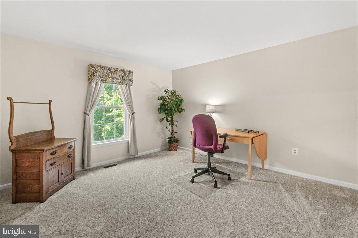 2218 West Greenleaf Drive Frederick, MD 21702 - Photo 34 of 46 a view of a workspace with furniture and a window