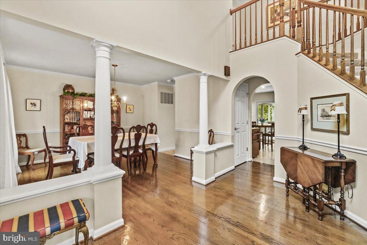 2218 West Greenleaf Drive Frederick, MD 21702 - Photo 37 of 46 a living room with furniture dining table and wooden floor