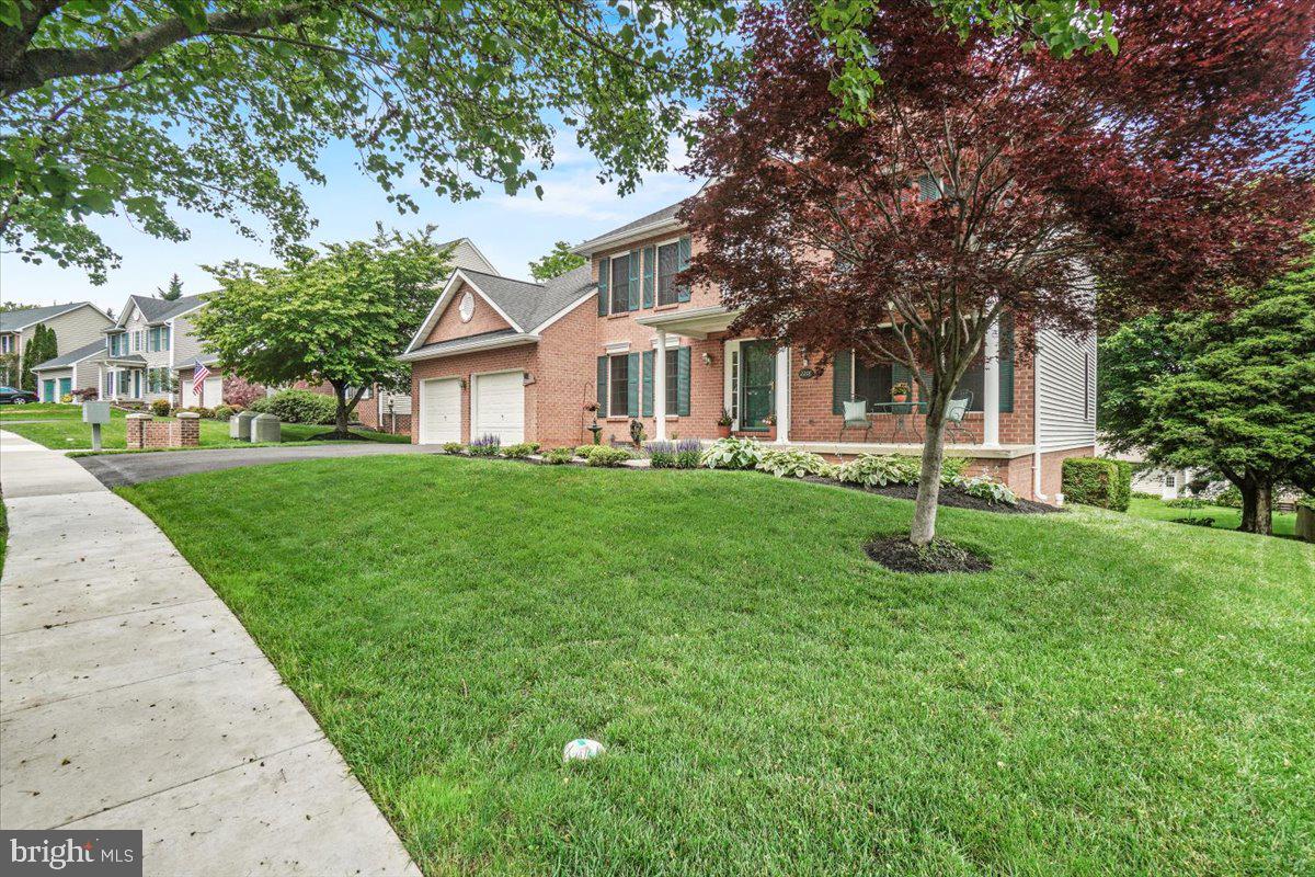 2218 West Greenleaf Drive Frederick, MD 21702 - Photo 42 of 46 a front view of house with yard and green space
