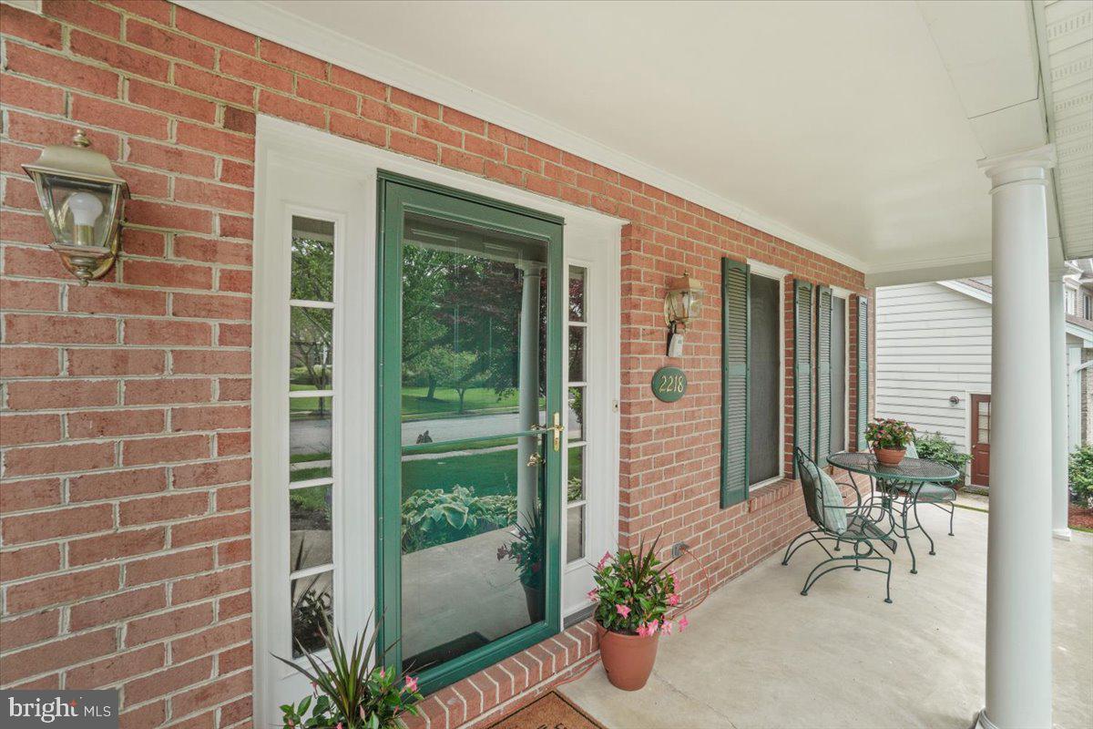 2218 West Greenleaf Drive Frederick, MD 21702 - Photo 5 of 46 a front view of a house with a garden