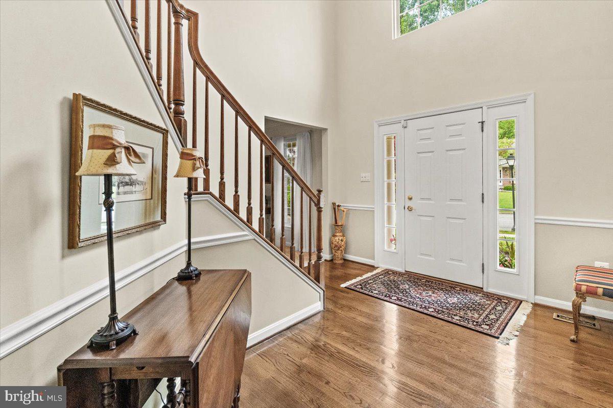 2218 West Greenleaf Drive Frederick, MD 21702 - Photo 6 of 46 a view of entryway and hall with wooden floor