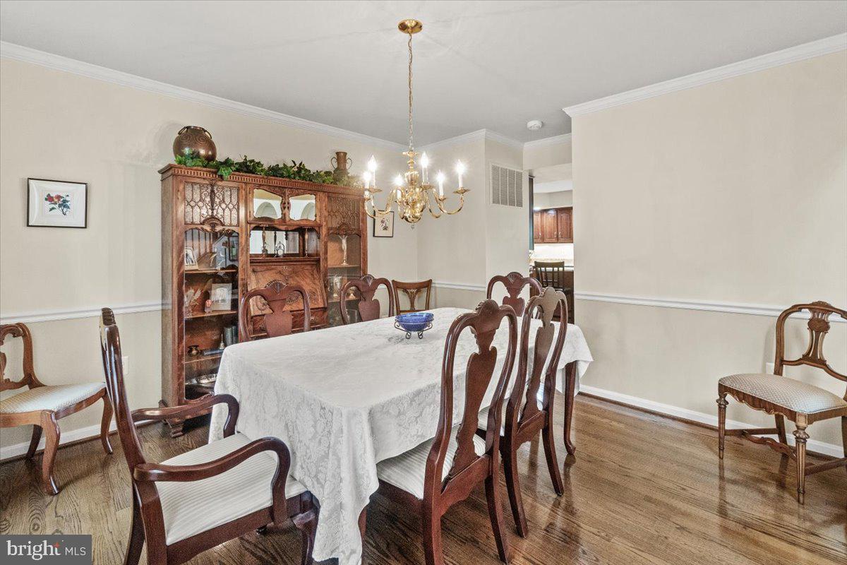 2218 West Greenleaf Drive Frederick, MD 21702 - Photo 7 of 46 a view of a dining room with furniture and wooden floor