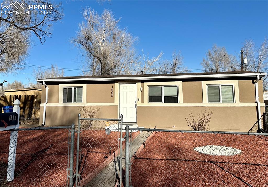 Cute stucco rancher is in a prime location with room for RV parking!! NEW mulch and a freshly painted stoop add to the appeal.