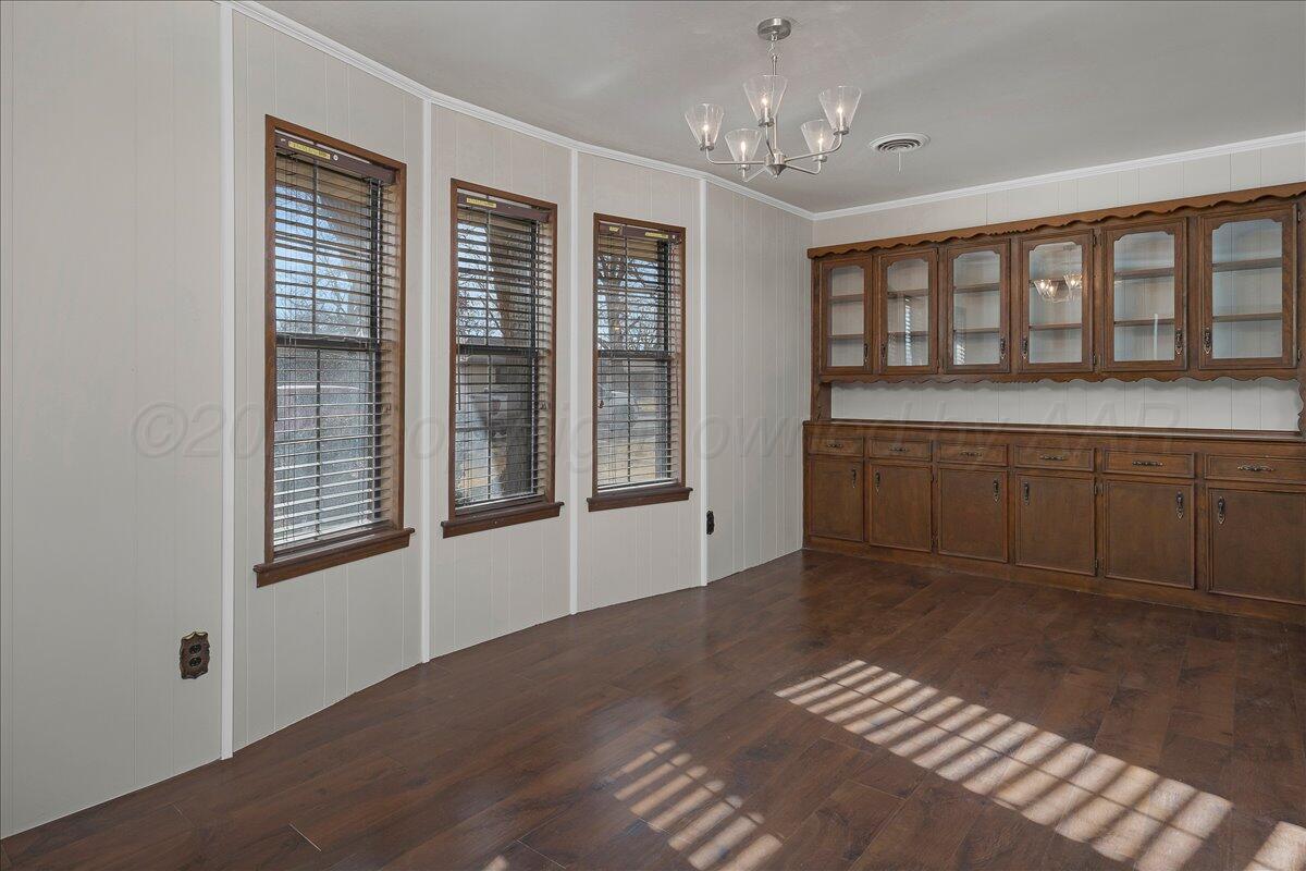 7606 Canode Drive Amarillo, TX 79121 - Photo 13 of 30 a view of an empty room with a kitchen