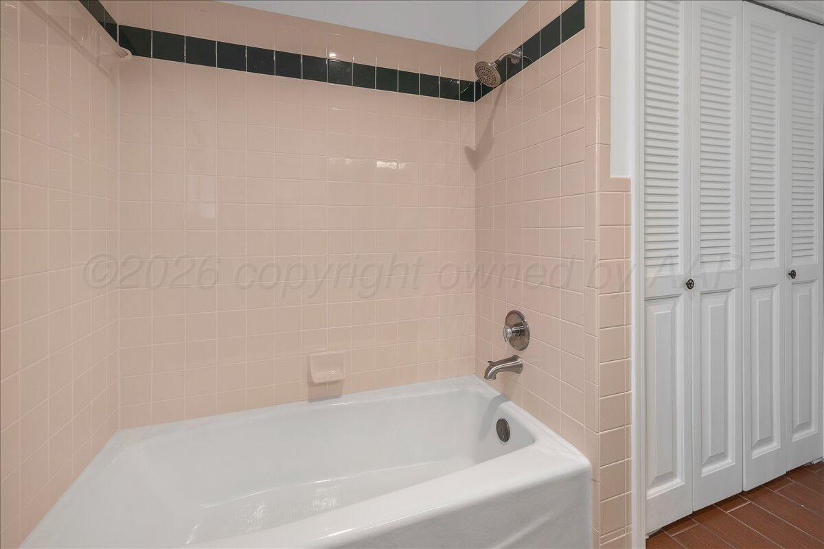 7606 Canode Drive Amarillo, TX 79121 - Photo 25 of 30 a white bath tub sitting next to a shower