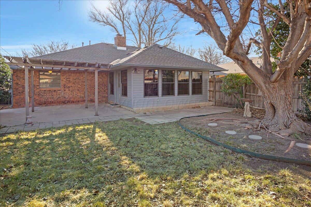 7606 Canode Drive Amarillo, TX 79121 - Photo 27 of 30 a front view of a house with garden