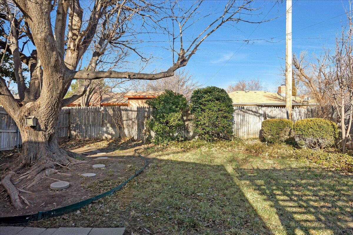 7606 Canode Drive Amarillo, TX 79121 - Photo 29 of 30 a view of a yard with large trees