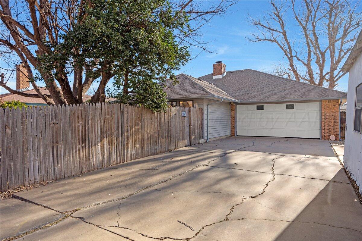 7606 Canode Drive Amarillo, TX 79121 - Photo 30 of 30 a house with trees in front of it
