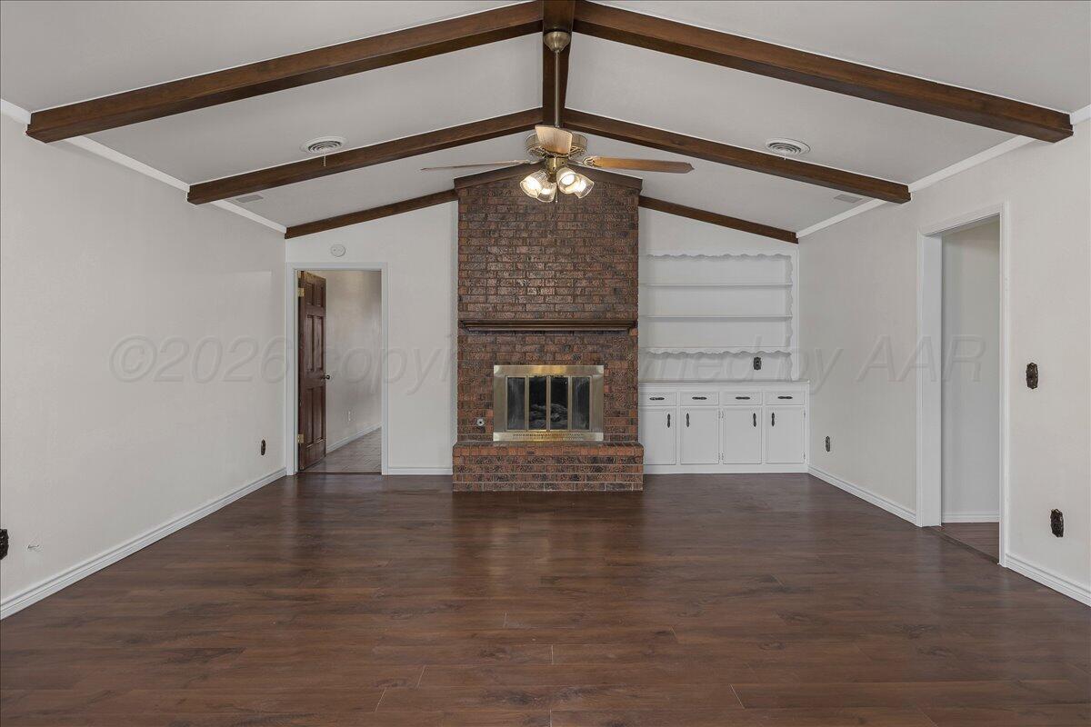 7606 Canode Drive Amarillo, TX 79121 - Photo 3 of 30 a view of a livingroom with wooden floor and a ceiling fan