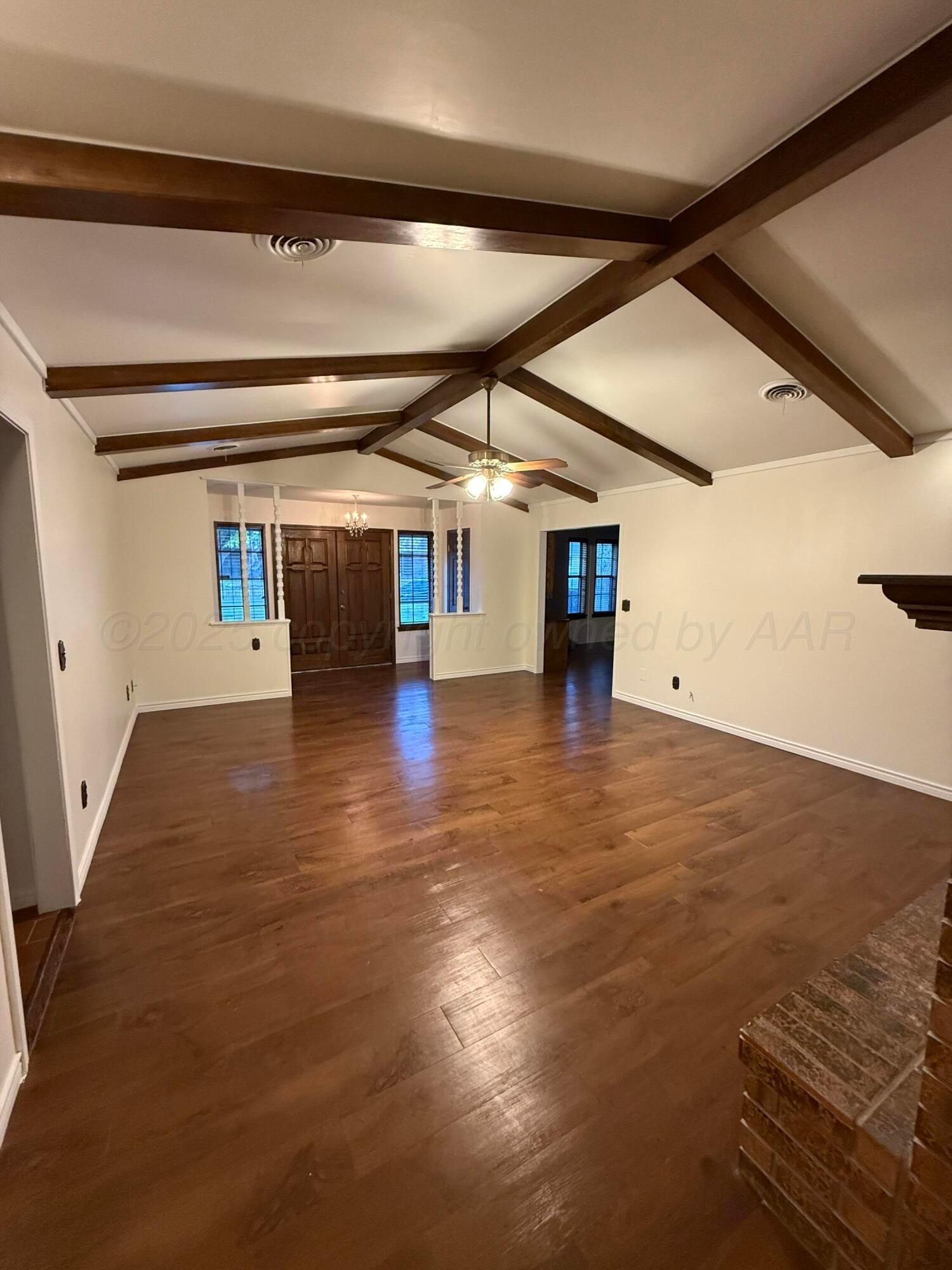 7606 Canode Drive Amarillo, TX 79121 - Photo 4 of 20 wooden floor in an empty room