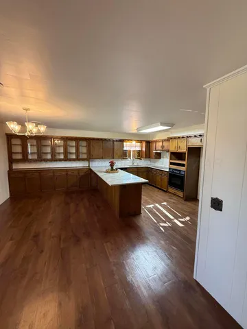 a kitchen with stainless steel appliances granite countertop a stove and a refrigerator