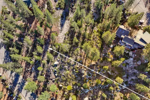 a view of a lush green hillside and a building