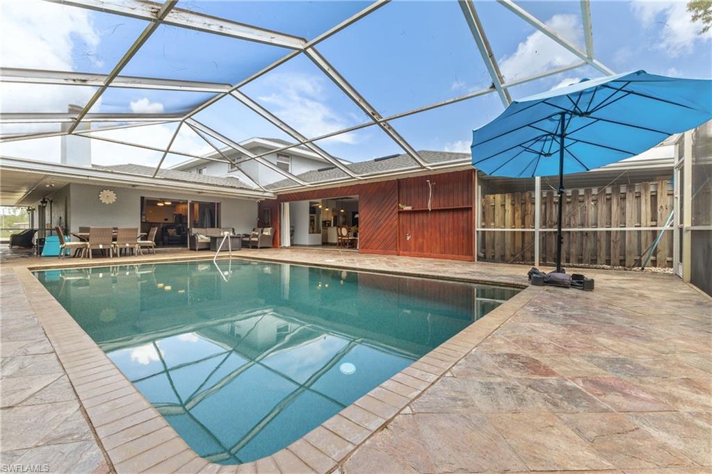 8012 Kansas Road Fort Myers, FL 33967 - Photo 15 of 44 View of swimming pool with a lanai and a patio area