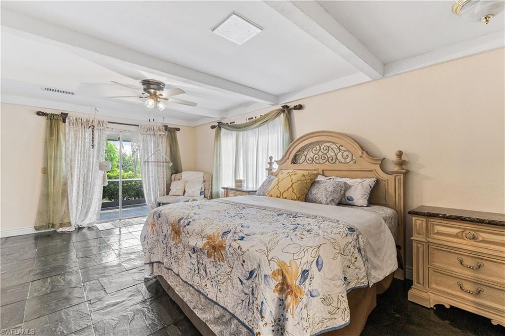 8012 Kansas Road Fort Myers, FL 33967 - Photo 17 of 44 Bedroom with beamed ceiling, access to outside, and ceiling fan