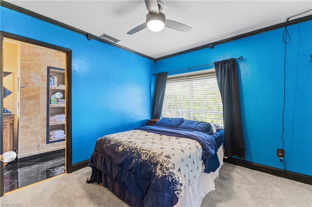 8012 Kansas Road Fort Myers, FL 33967 - Photo 25 of 44 Bedroom with carpet, ornamental molding, and ceiling fan