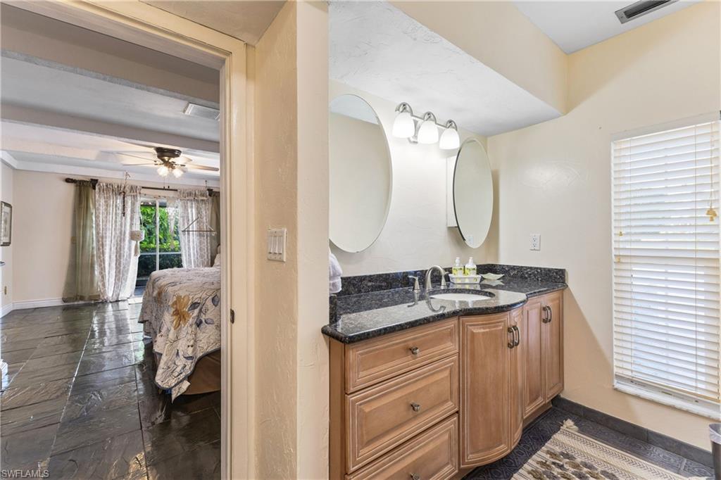 8012 Kansas Road Fort Myers, FL 33967 - Photo 28 of 44 Bathroom with ceiling fan and vanity