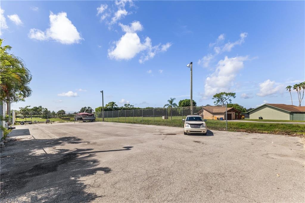 8012 Kansas Road Fort Myers, FL 33967 - Photo 7 of 44 Double lot next to property - was tennis/basketball court with lights