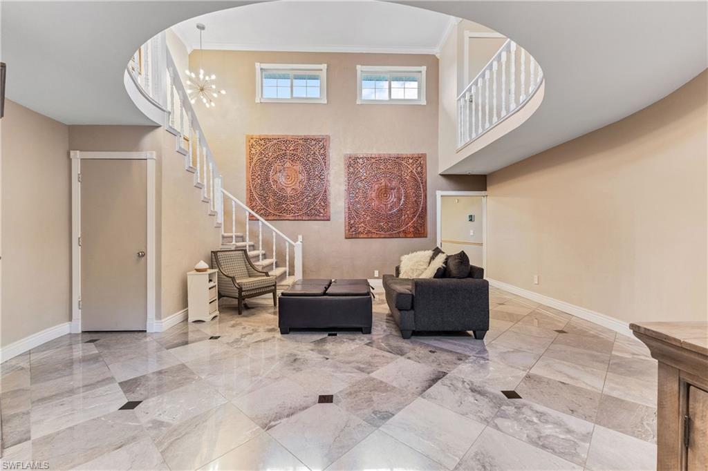 8012 Kansas Road Fort Myers, FL 33967 - Photo 9 of 44 Sitting room featuring crown molding and an inviting chandelier