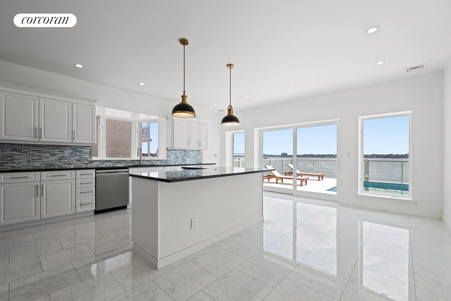 4 Angelas Place Bronx, NY 10026 - Photo 12 of 68 a kitchen with stainless steel appliances granite countertop a sink and cabinets