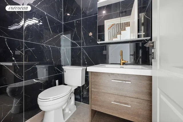 a bathroom with a toilet a sink and a shower