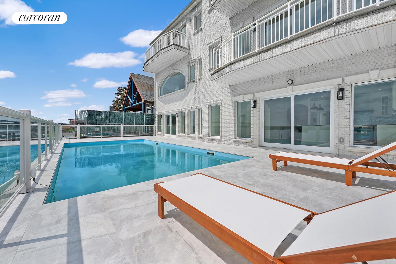 4 Angelas Place Bronx, NY 10026 - Photo 18 of 68 a view of a house with a swimming pool