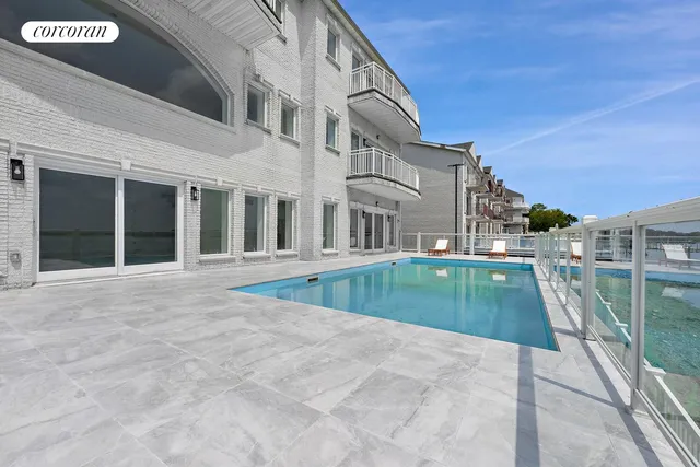 a bedroom with a large bed and a couch