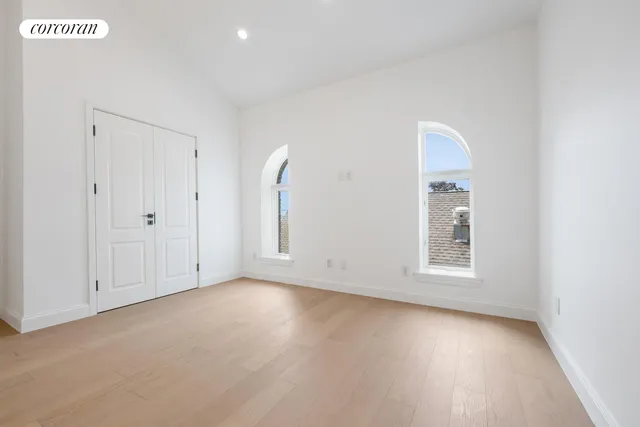 a living room with furniture and flowers