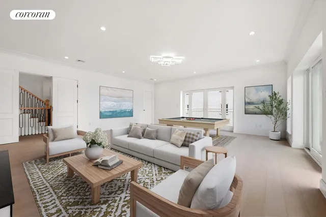 an empty room with furniture and a fireplace