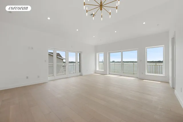 a front view of a building with parking area