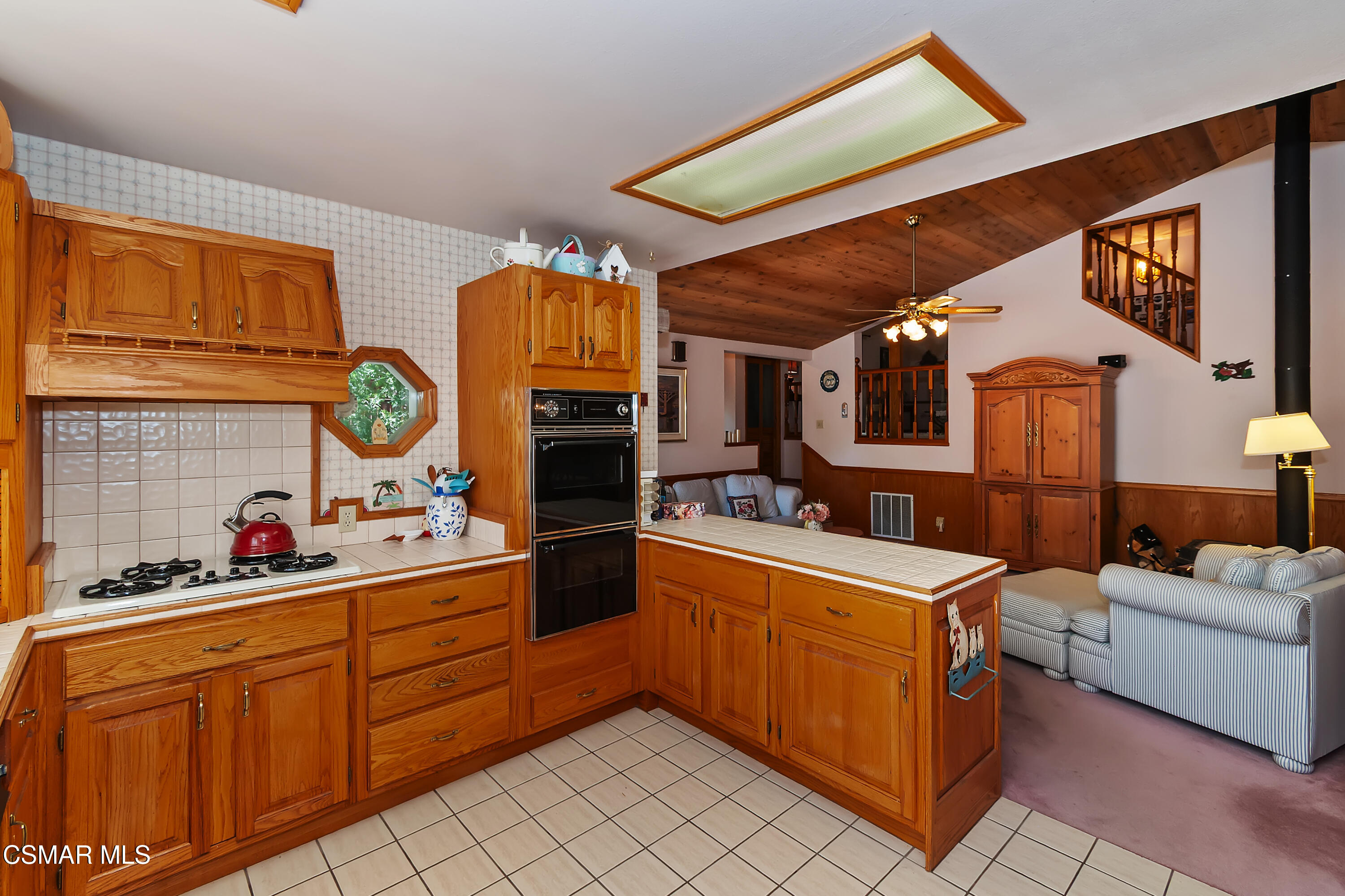 27618 West Shore Road Lake Arrowhead, CA 92352 - Photo 21 of 50 a kitchen that has a lot of cabinets in it