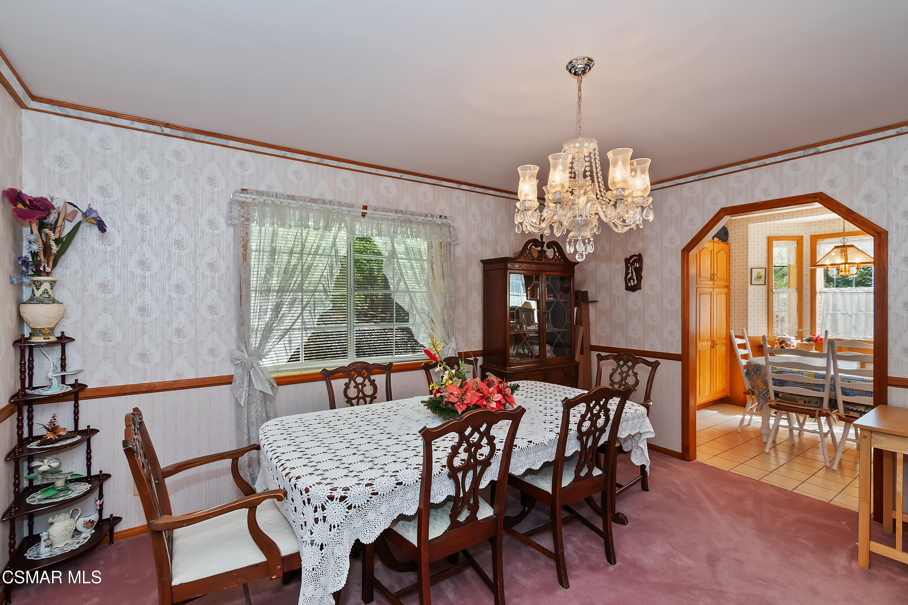 27618 West Shore Road Lake Arrowhead, CA 92352 - Photo 23 of 50 a dining room with furniture a chandelier and a rug