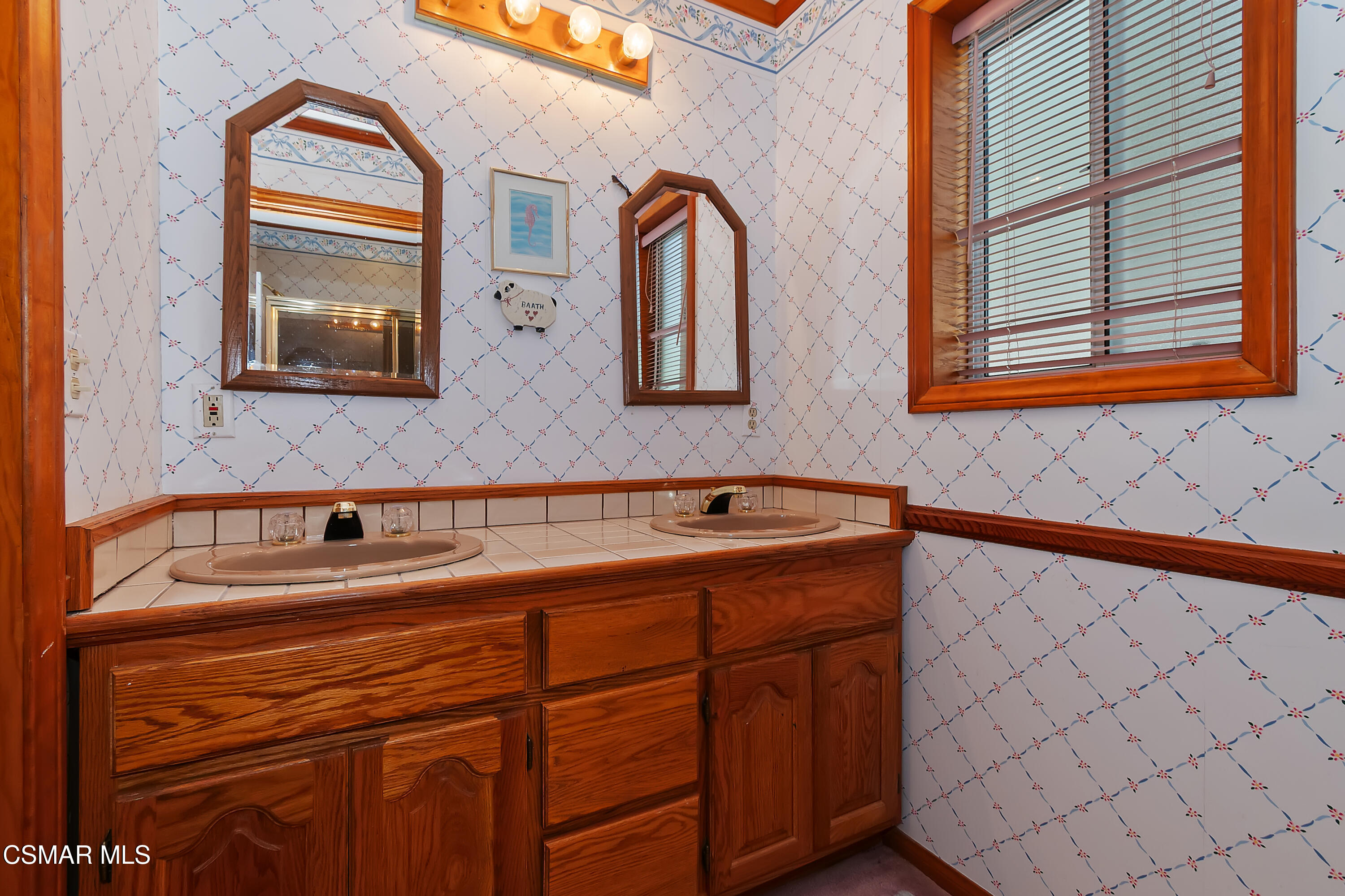 27618 West Shore Road Lake Arrowhead, CA 92352 - Photo 34 of 50 a bathroom with a sink and a mirror