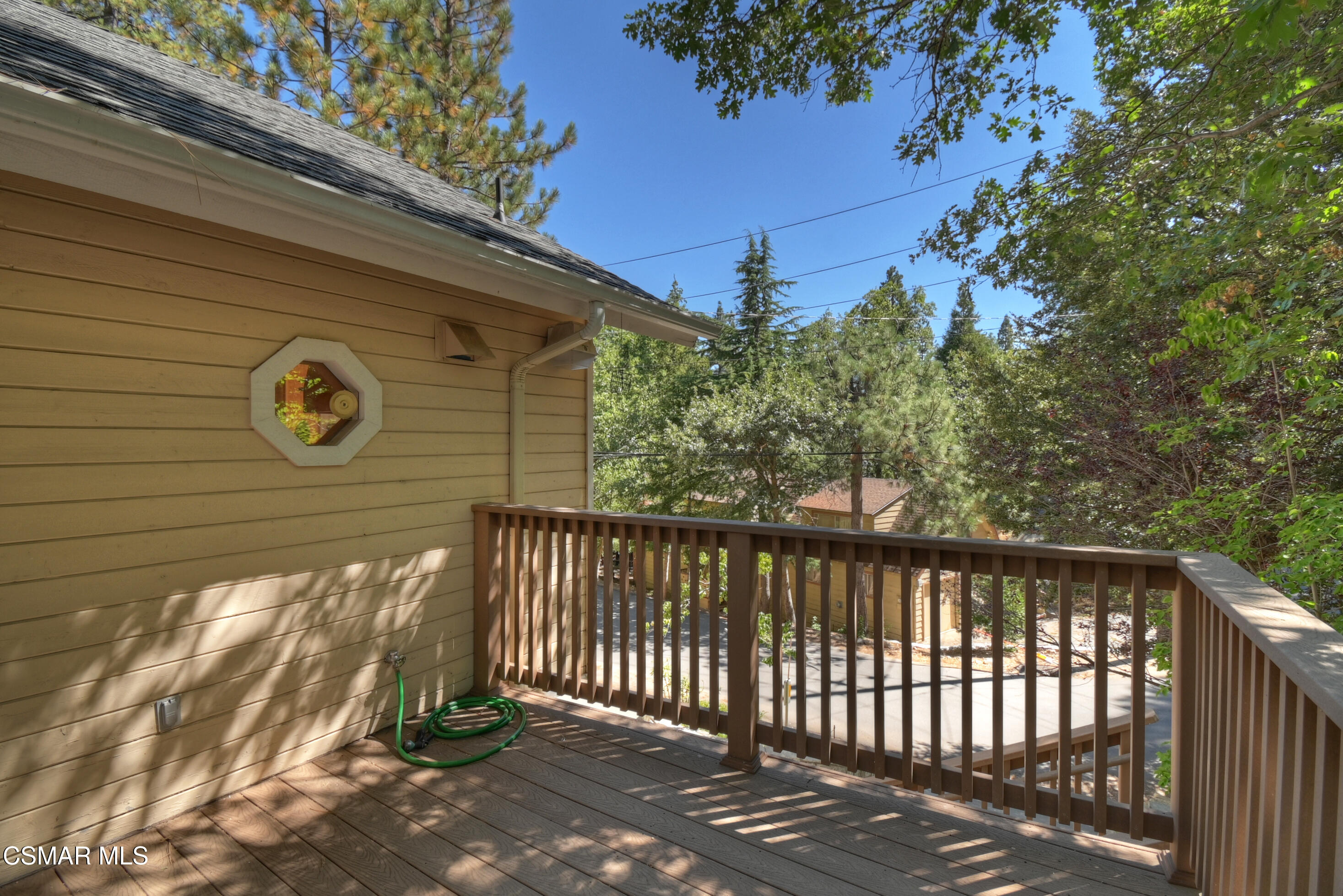27618 West Shore Road Lake Arrowhead, CA 92352 - Photo 41 of 50 a front view of a house with a garden