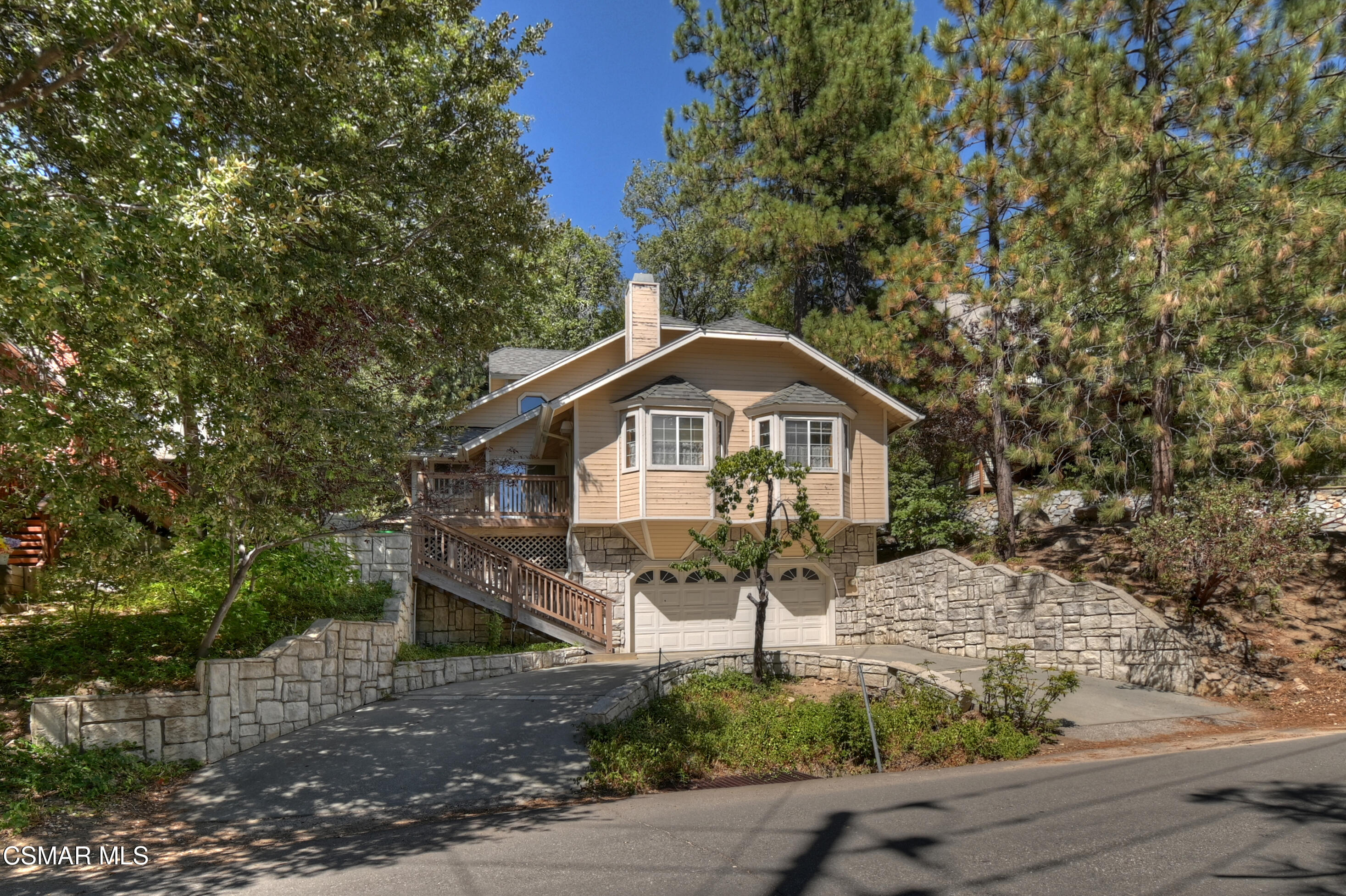 27618 West Shore Road Lake Arrowhead, CA 92352 - Photo 8 of 50 a front view of a house with a yard and large tree