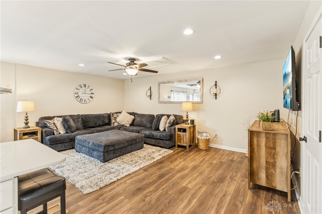 4934 Castleton Drive Fairfield, OH 45014 - Photo 7 of 36 This inviting living space features warm flooring, creating a comfortable and modern atmosphere.
