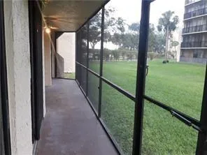 a view of balcony with yard