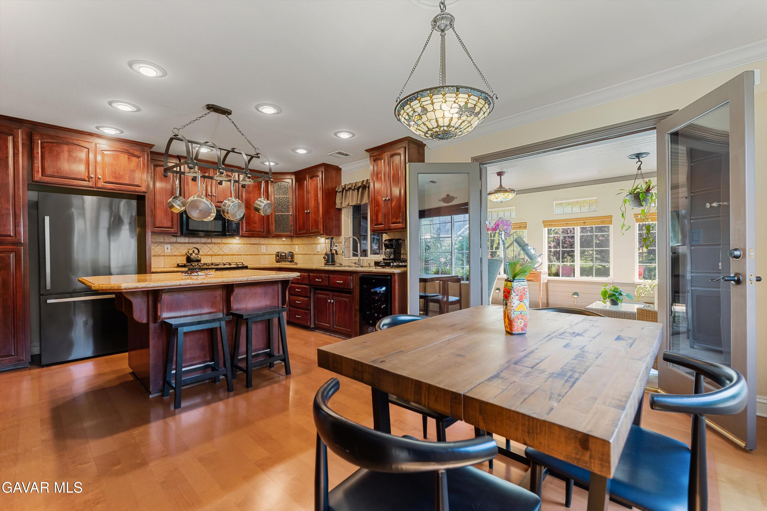 18250 Arosa Road Tehachapi, CA 93561 - Photo 12 of 71 a view of a dining room with furniture window and wooden floor