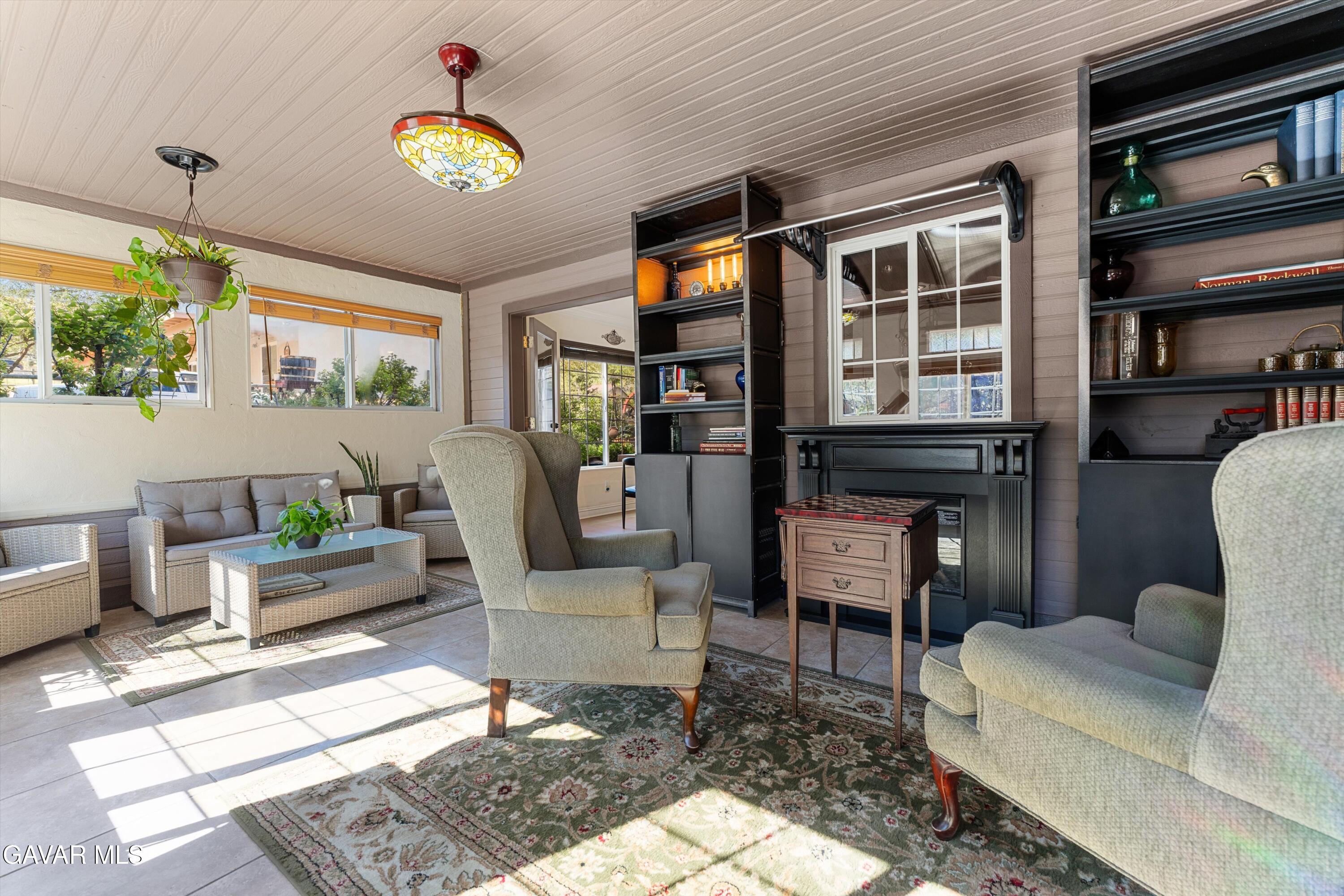 18250 Arosa Road Tehachapi, CA 93561 - Photo 16 of 71 a living room with furniture fireplace and a large window