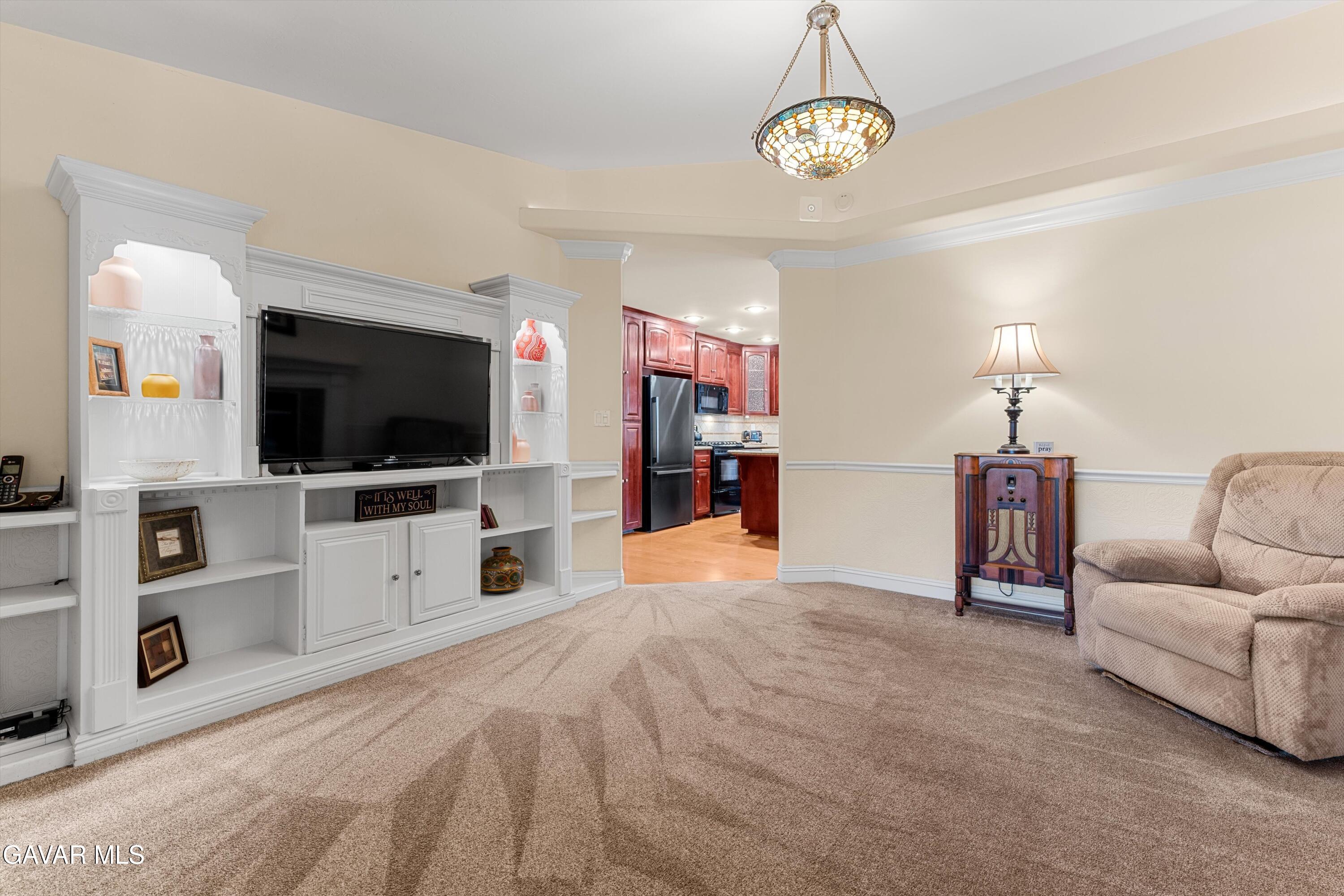 18250 Arosa Road Tehachapi, CA 93561 - Photo 17 of 71 a living room with furniture and a flat screen tv