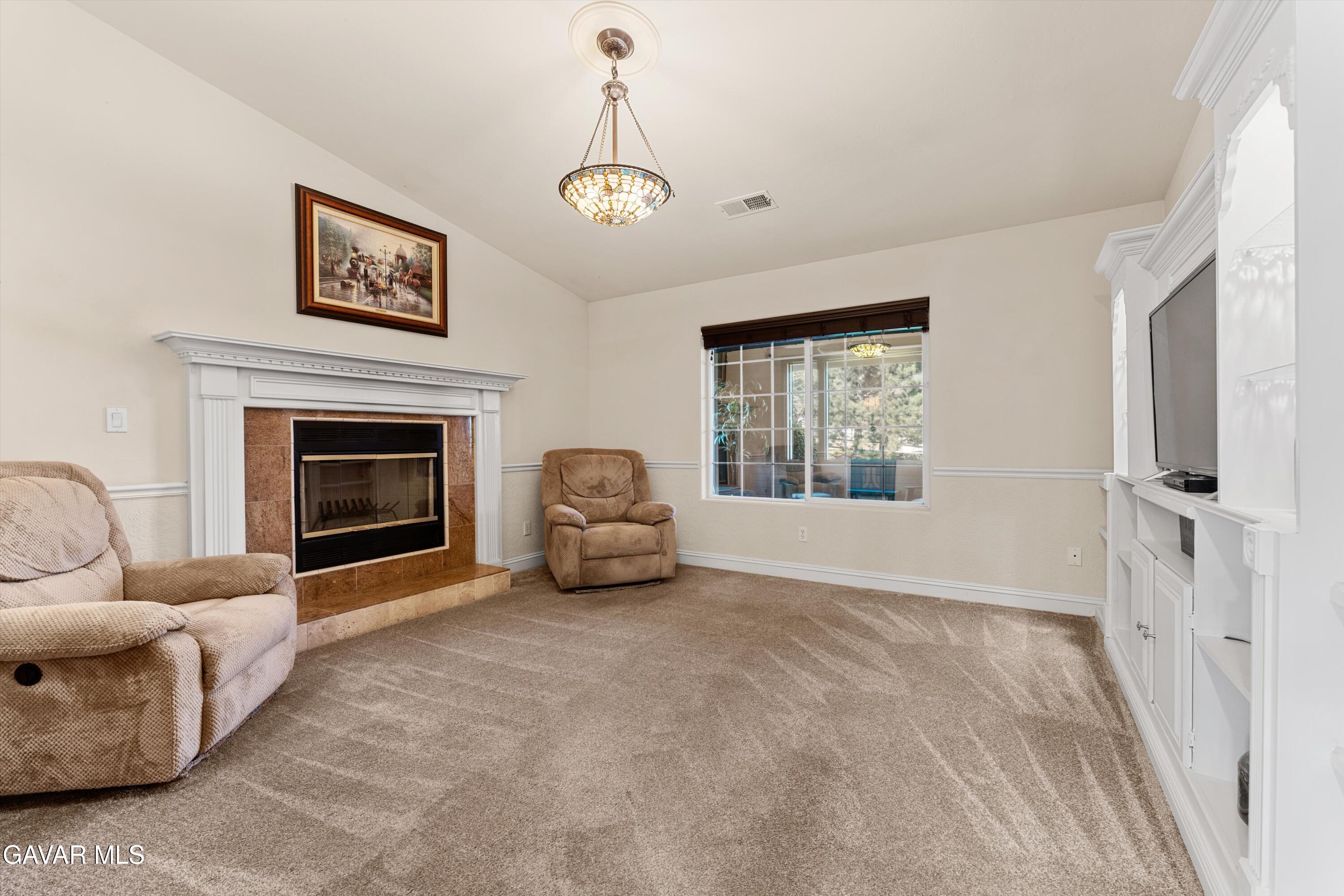 18250 Arosa Road Tehachapi, CA 93561 - Photo 18 of 71 a living room with furniture and a fireplace