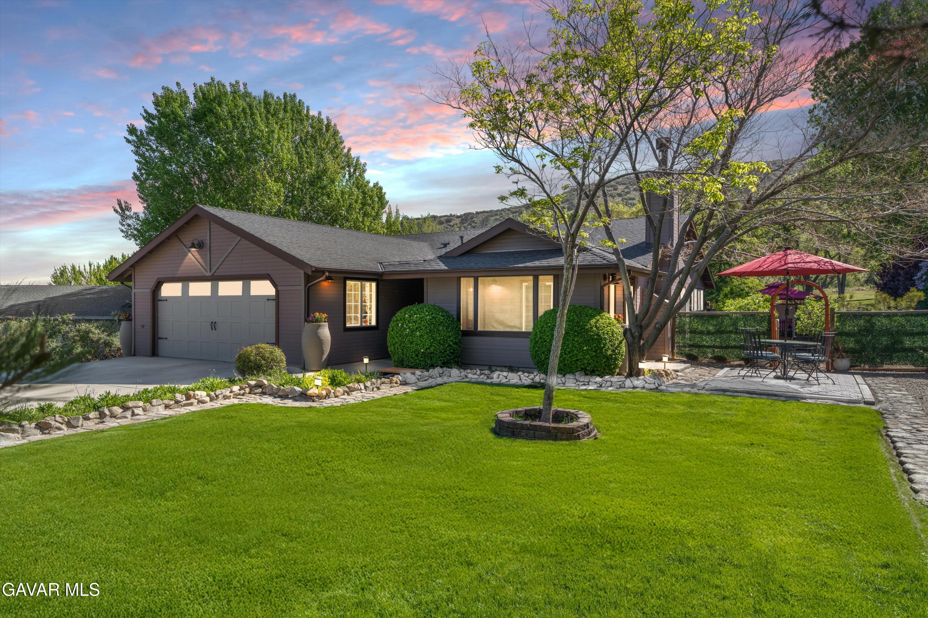 18250 Arosa Road Tehachapi, CA 93561 - Photo 2 of 71 a house with garden in front of it