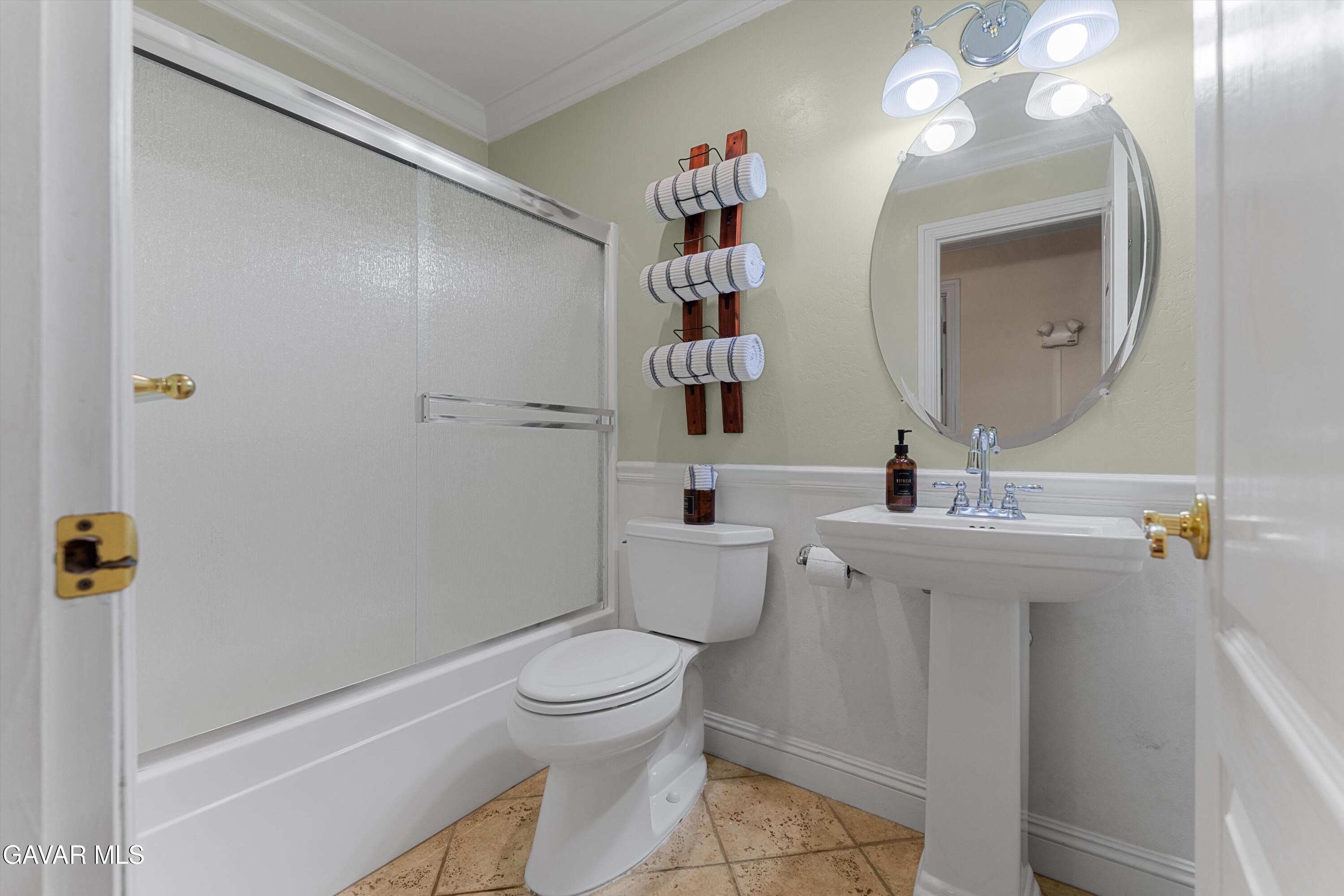 18250 Arosa Road Tehachapi, CA 93561 - Photo 21 of 71 a bathroom with a toilet a sink and mirror