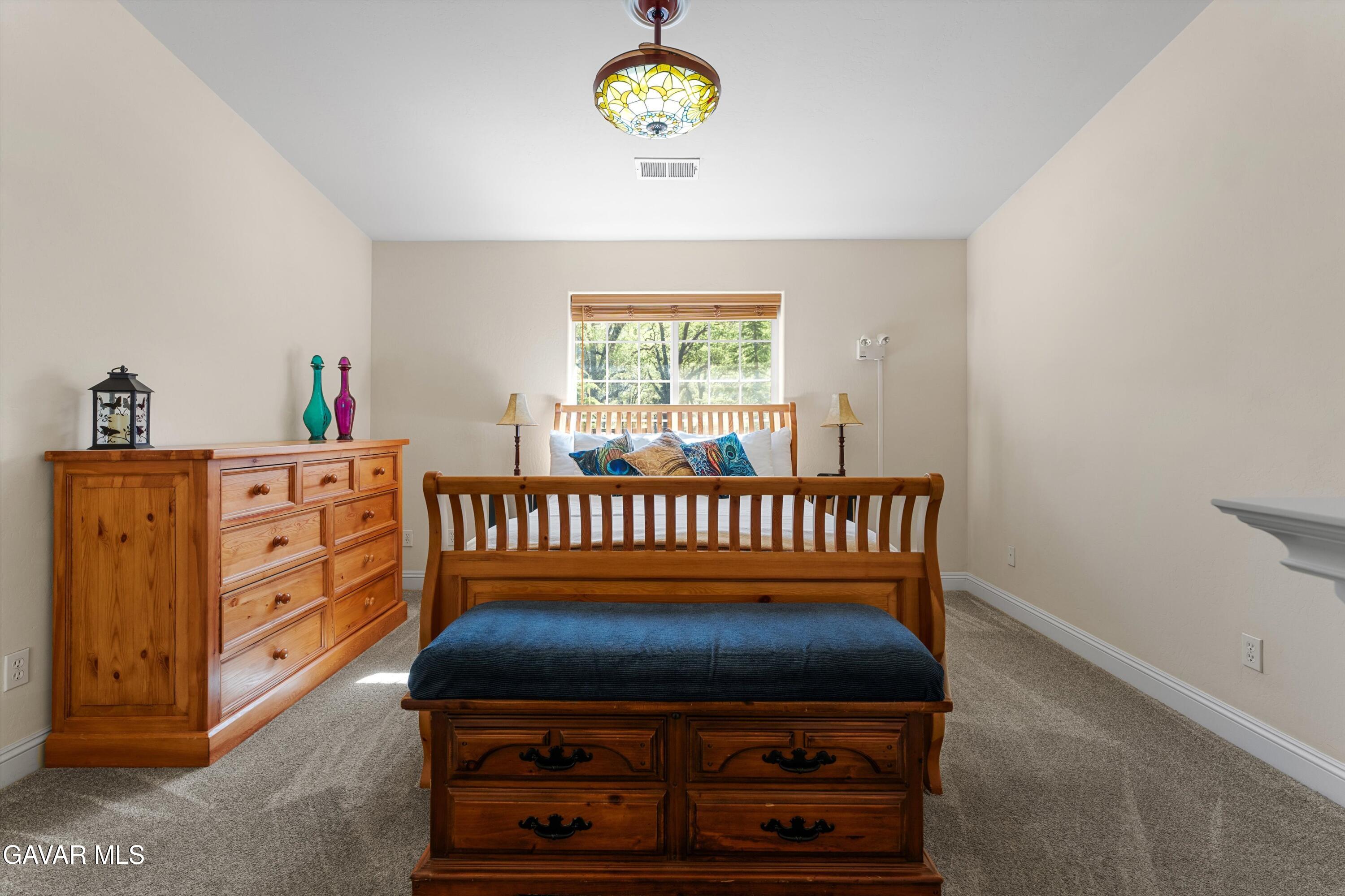 18250 Arosa Road Tehachapi, CA 93561 - Photo 23 of 71 a bedroom with a bed and a window