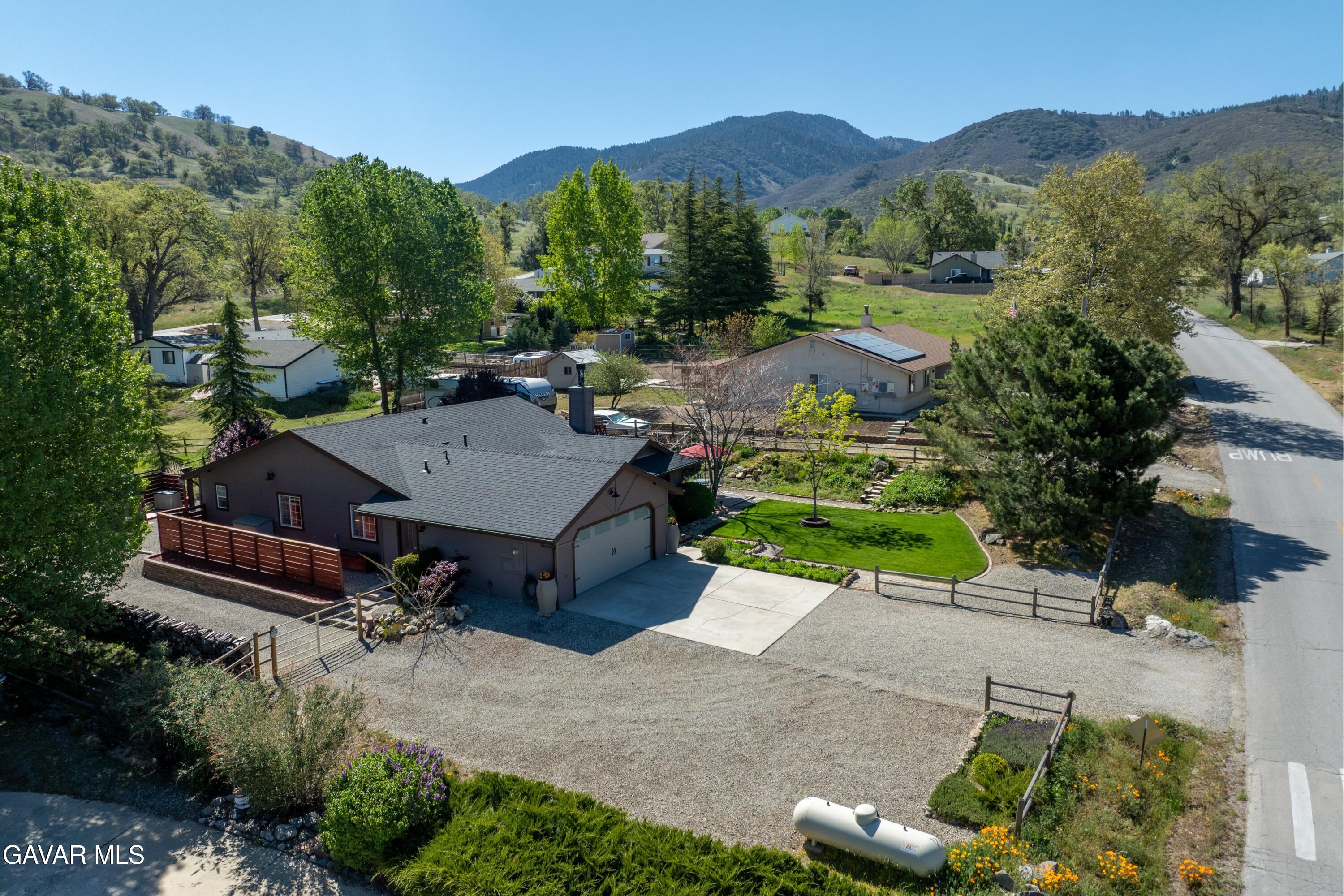18250 Arosa Road Tehachapi, CA 93561 - Photo 42 of 71 an aerial view of a house with a garden