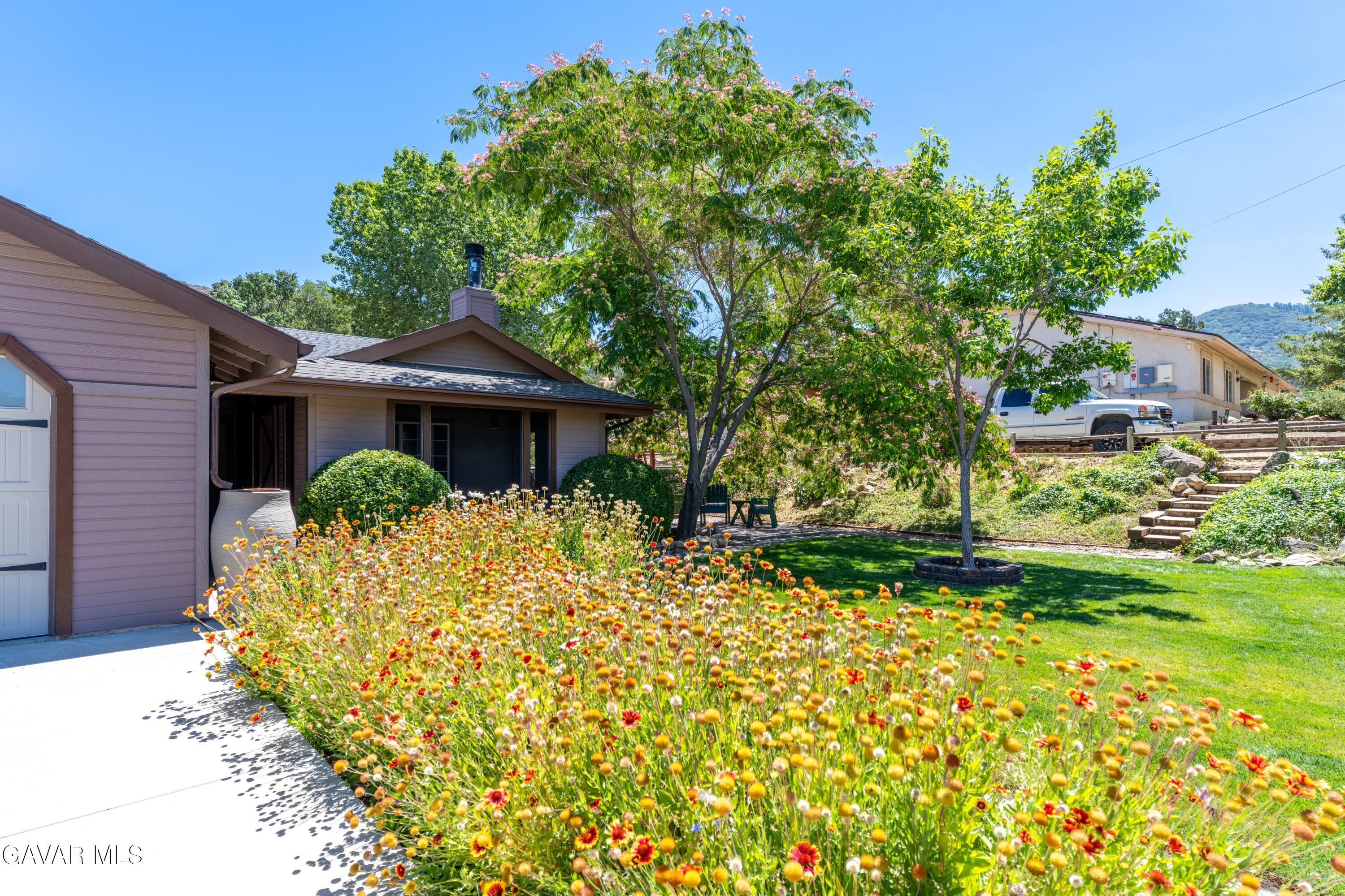 18250 Arosa Road Tehachapi, CA 93561 - Photo 5 of 71 a front view of a house with garden