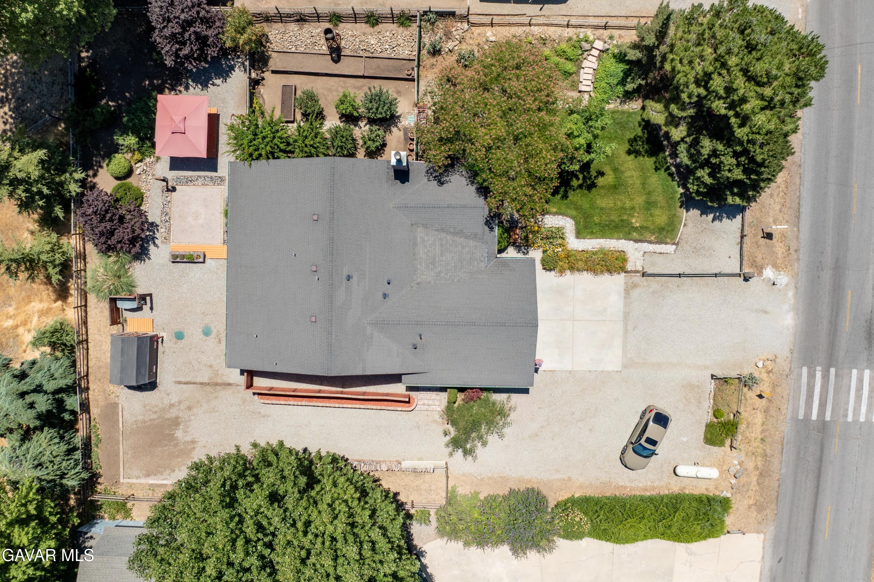 18250 Arosa Road Tehachapi, CA 93561 - Photo 57 of 71 an aerial view of a house with swimming pool and garden