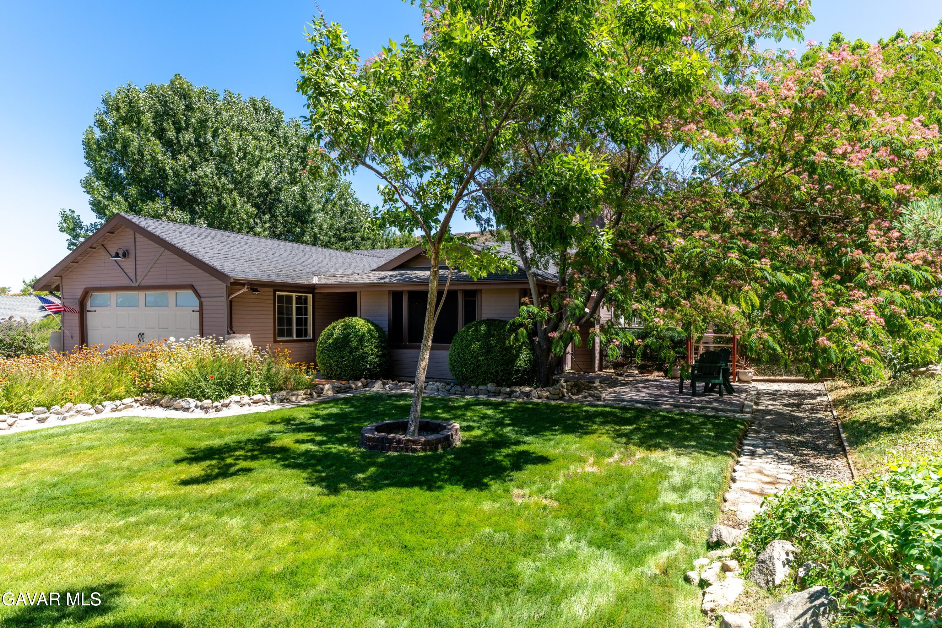 18250 Arosa Road Tehachapi, CA 93561 - Photo 65 of 71 a front view of a house with a yard