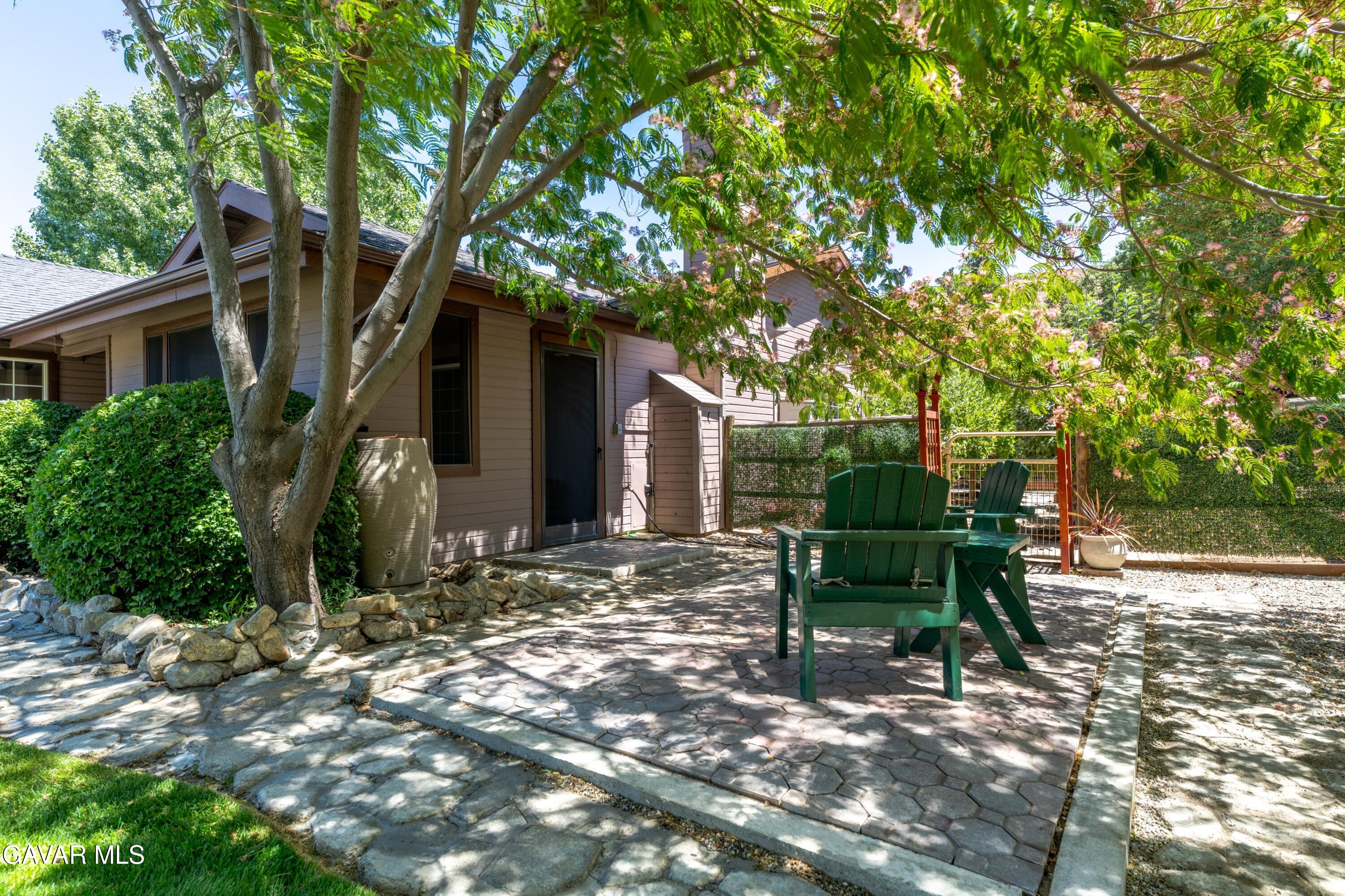 18250 Arosa Road Tehachapi, CA 93561 - Photo 66 of 71 a view of a chairs and table in a backyard
